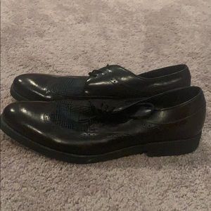 Black Gucci shoes with coloured patch like top.